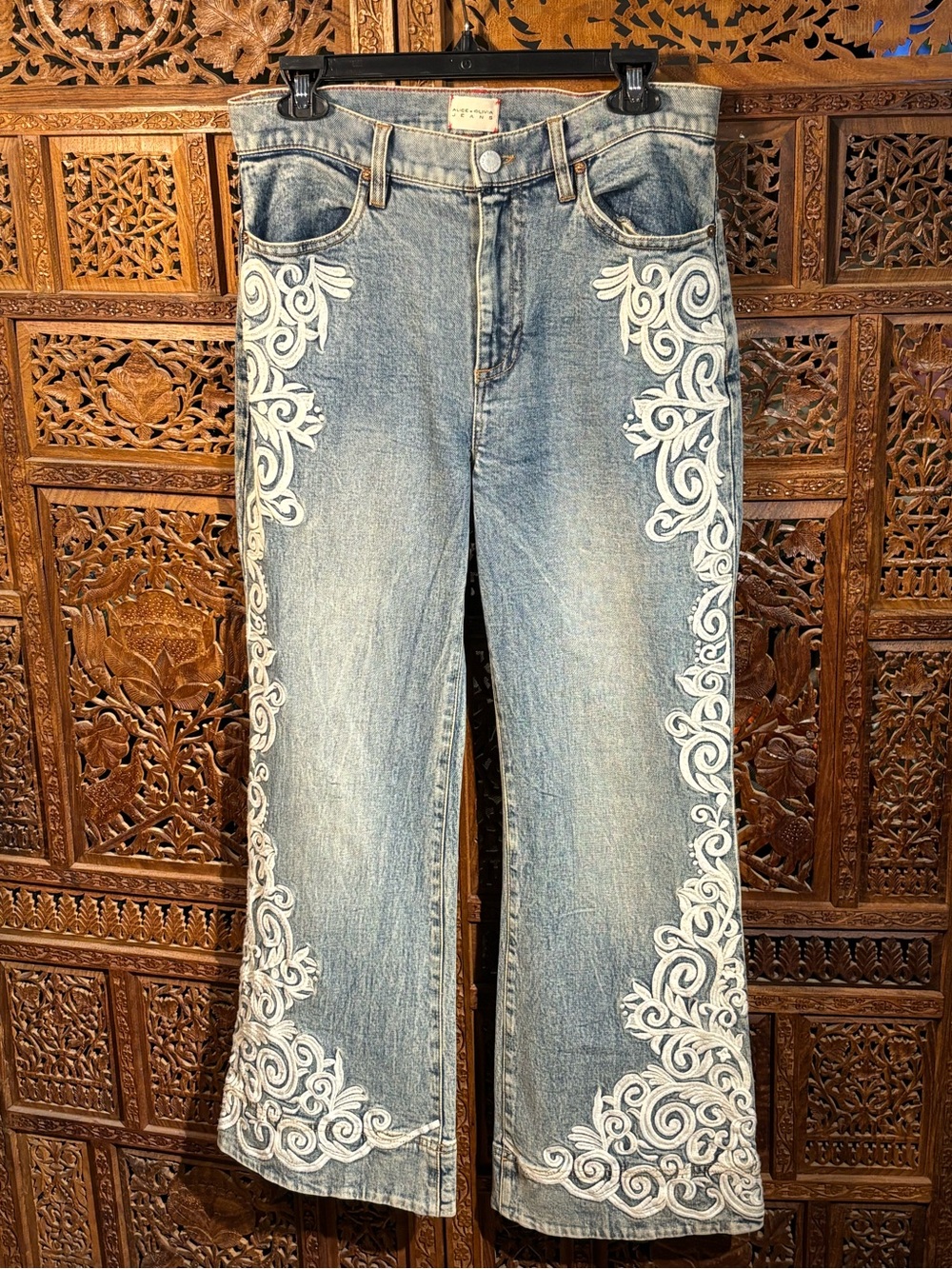 Alice + Olivia Light Blue Flared Jeans with White Embroidered Scrolls
